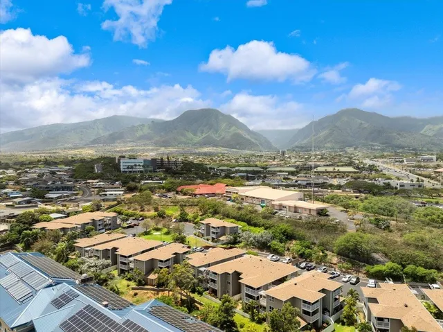 a view of a city with mountains in the background