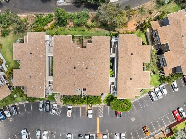 an aerial view of a house with outdoor space