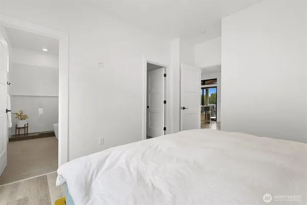 a bedroom with a bed and a table