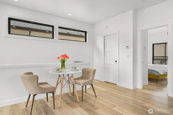 a kitchen with a table chairs stove and microwave
