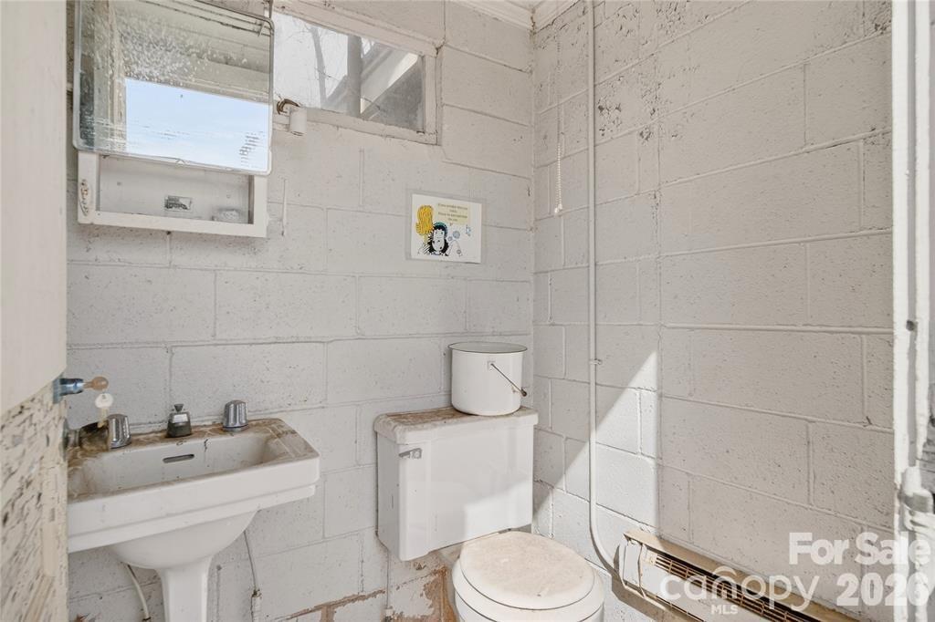 11124 Eastfield Road Huntersville, NC 28078 - Photo 39 of 41 a white toilet sitting next to a bathroom sink