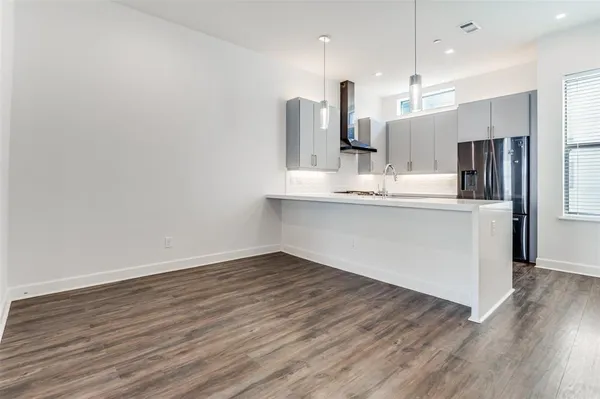 a view of kitchen with wooden floor