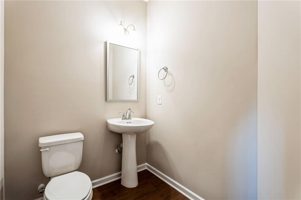 23 Whiterock Road Phenix City, AL 36869 - Photo 11 of 29 Bathroom featuring wood finished floors, baseboards, and toilet