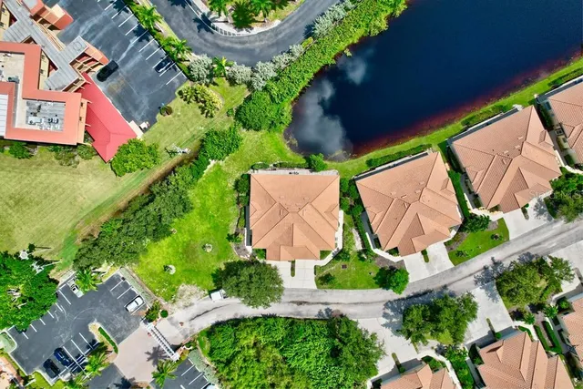 a living room with furniture chandelier and a large window