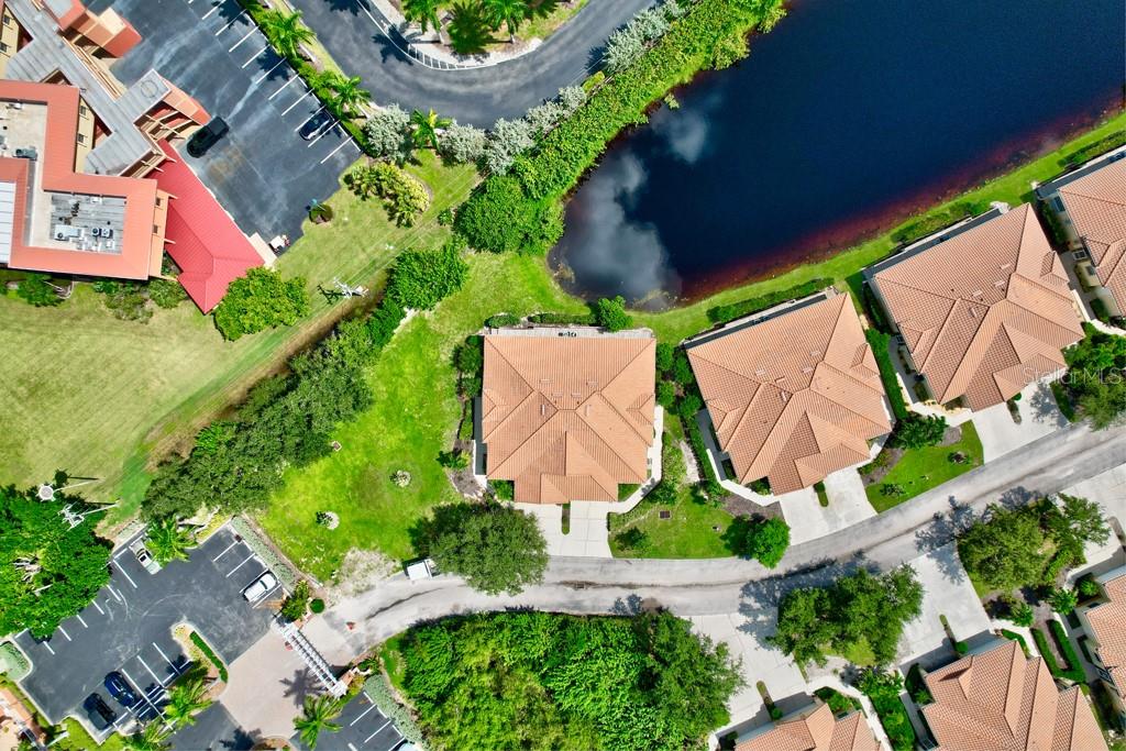 3181 Matecumbe Key Road, Unit 32 Punta Gorda, FL 33955 - Photo 11 of 42 an aerial view of house with yard swimming pool and outdoor seating