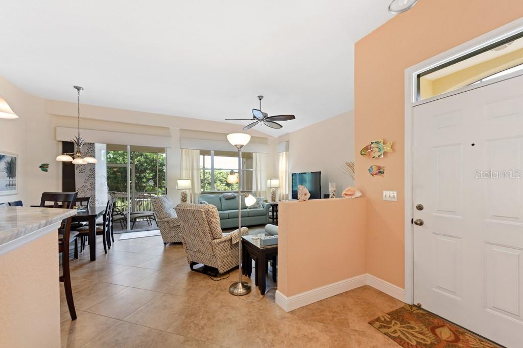 3181 Matecumbe Key Road, Unit 32 Punta Gorda, FL 33955 - Photo 23 of 42 a living room with furniture and a large window