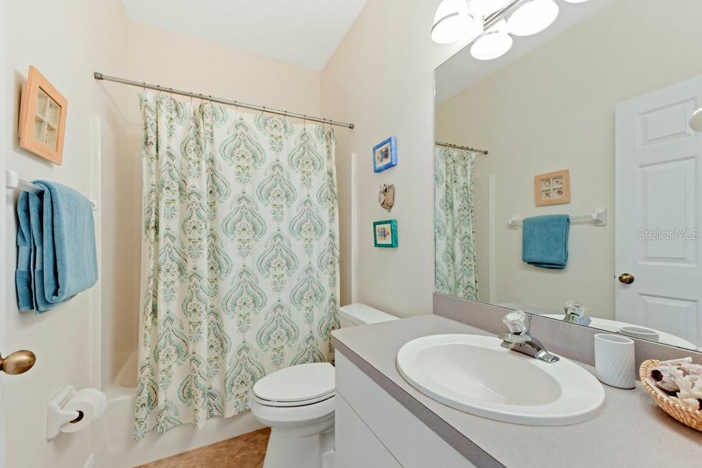 3181 Matecumbe Key Road, Unit 32 Punta Gorda, FL 33955 - Photo 27 of 42 a bathroom with a sink toilet and shower