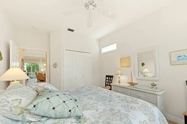 a bedroom with a bed and a table