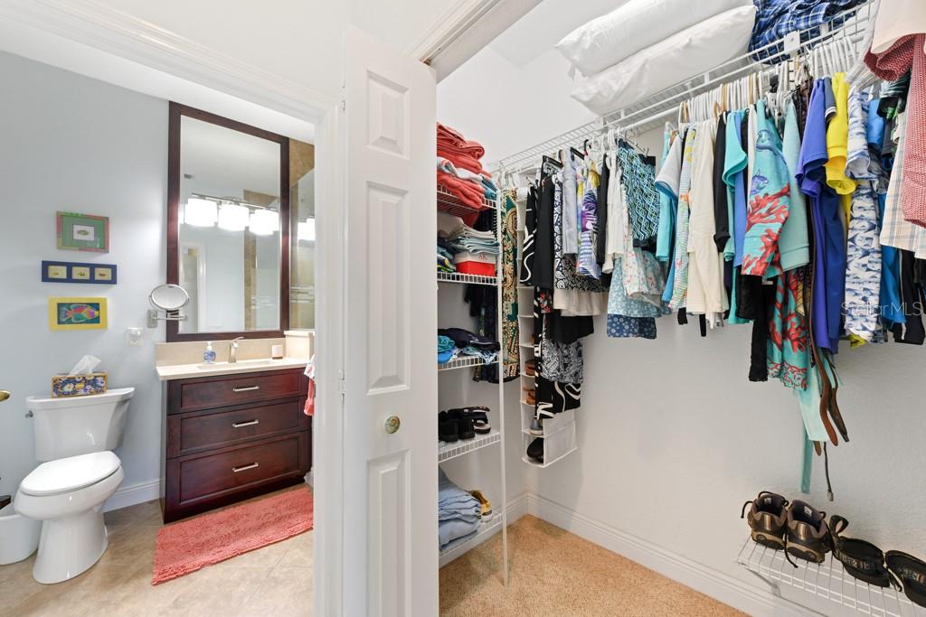 3181 Matecumbe Key Road, Unit 32 Punta Gorda, FL 33955 - Photo 34 of 42 a view of walk in closet with clothes and shoes