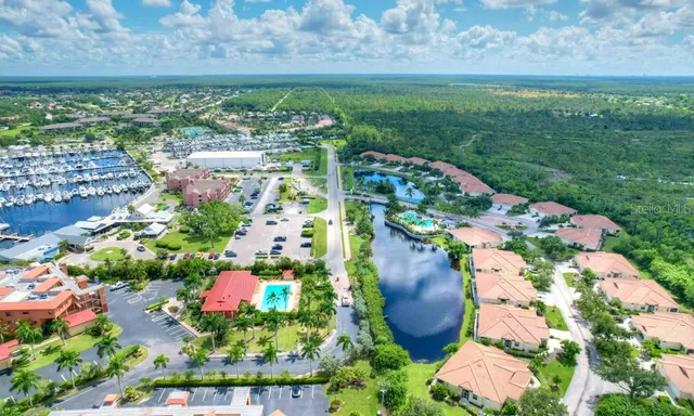 an aerial view of house with yard swimming pool and outdoor seating