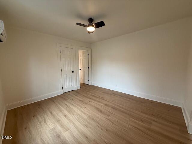 103 Broughton Street Garner, NC 27529 - Photo 14 of 15 a view of an empty room with wooden floor