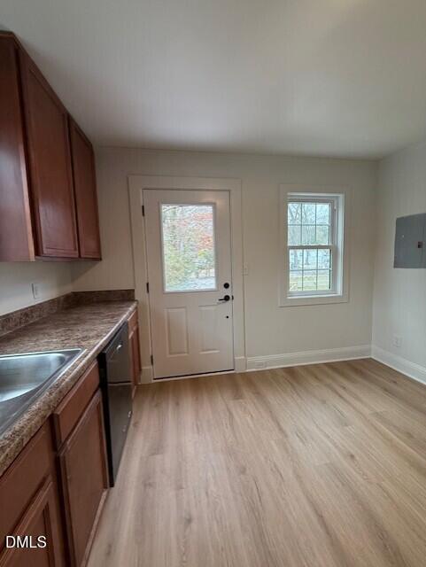 103 Broughton Street Garner, NC 27529 - Photo 8 of 15 an empty room with wooden floor and window