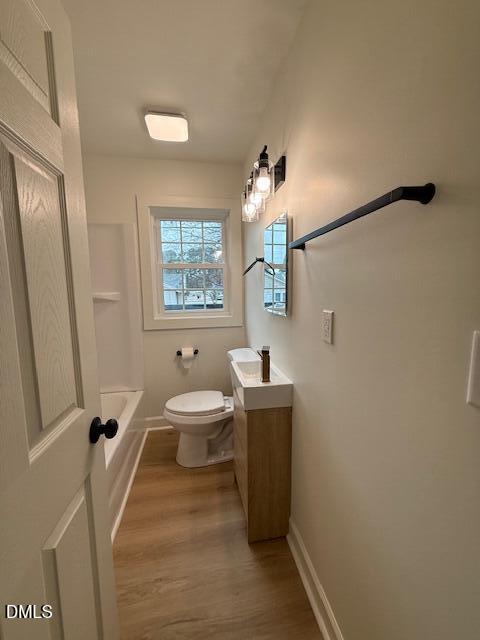 103 Broughton Street Garner, NC 27529 - Photo 10 of 15 a bathroom with a sink a toilet and mirror