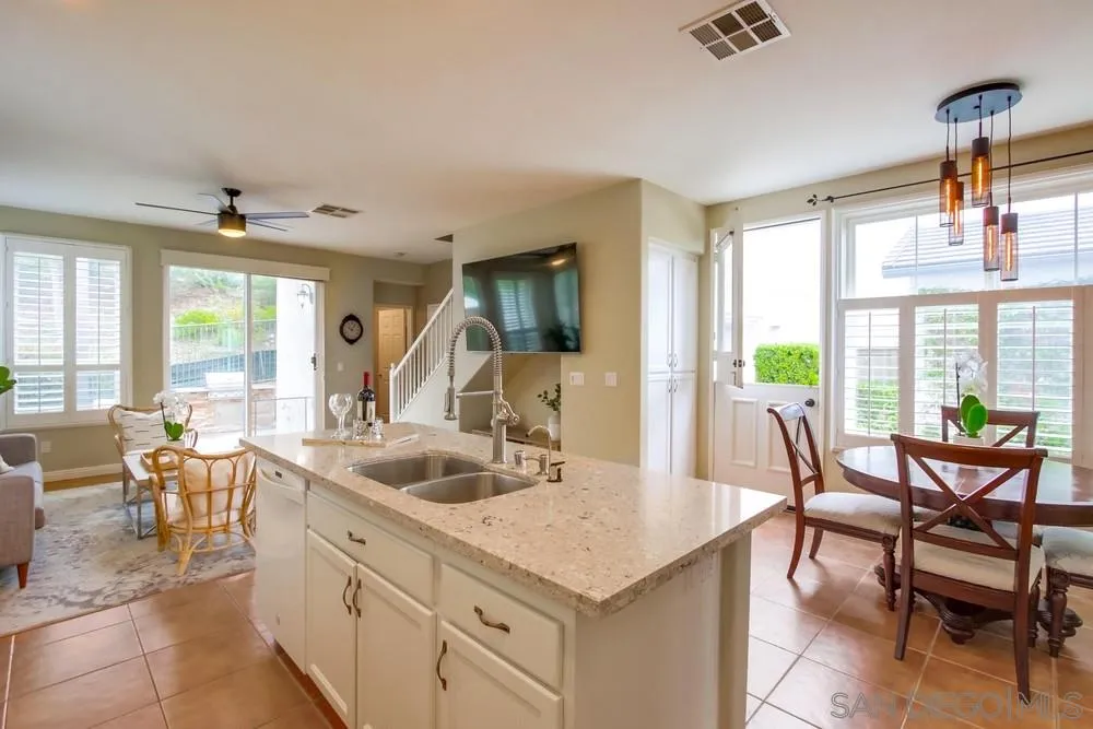 12237 Pepper Tree Lane Poway, CA 92064 - Photo 11 of 25 a view of a dining room with furniture window and outside view