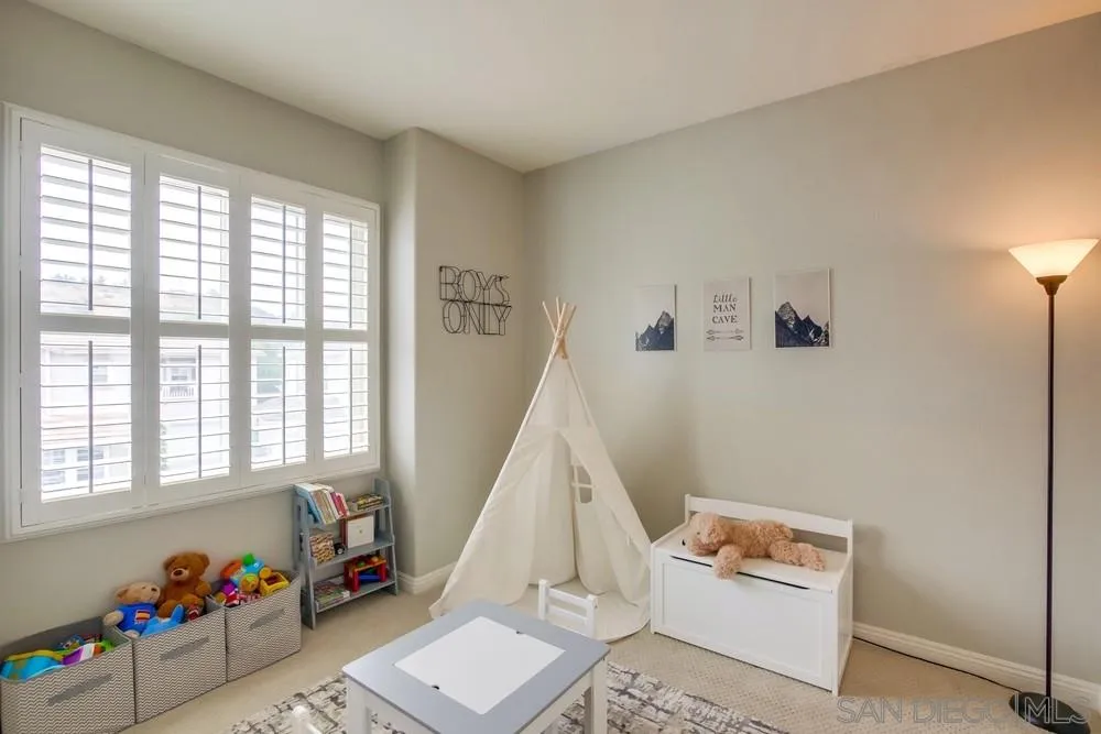 12237 Pepper Tree Lane Poway, CA 92064 - Photo 18 of 25 a room with furniture and a window
