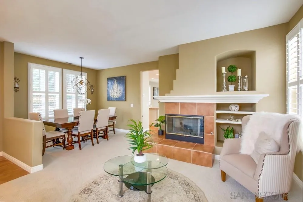 12237 Pepper Tree Lane Poway, CA 92064 - Photo 3 of 25 a living room with furniture and a fireplace
