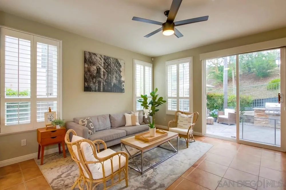 12237 Pepper Tree Lane Poway, CA 92064 - Photo 7 of 25 a living room with furniture and a large window