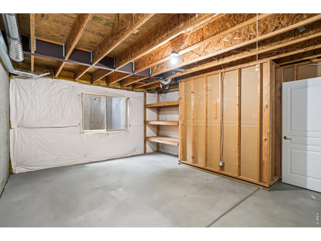 926 Hover Ridge Circle Longmont, CO 80501 - Photo 24 of 31 Unfinished half of basement with storage and laundry room
