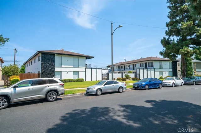 a view of a cars parked in front of a house