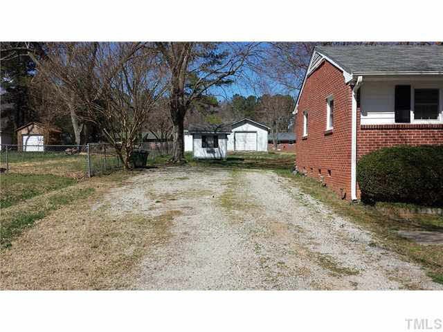 3704 Woodside Road Garner, NC 27529 - Photo 2 of 11 Storage building and the drive...wired workshop is to the right in the back. See next photo