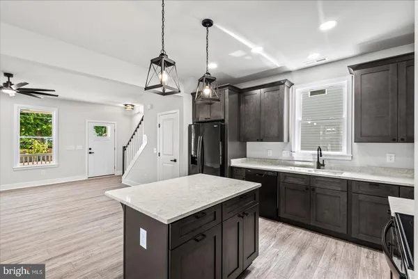 a dining room with furniture a rug and a chandelier