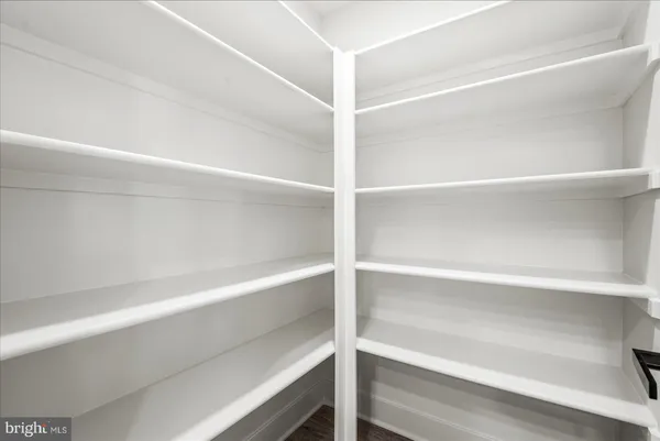 a bathroom with a granite countertop sink toilet a mirror and bathtub
