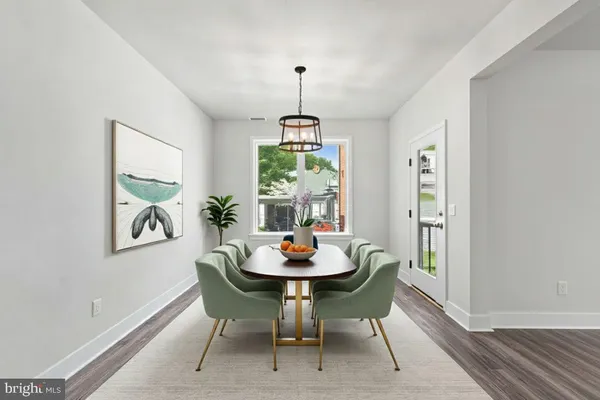 a bathroom with a sink vanity mirror and toilet
