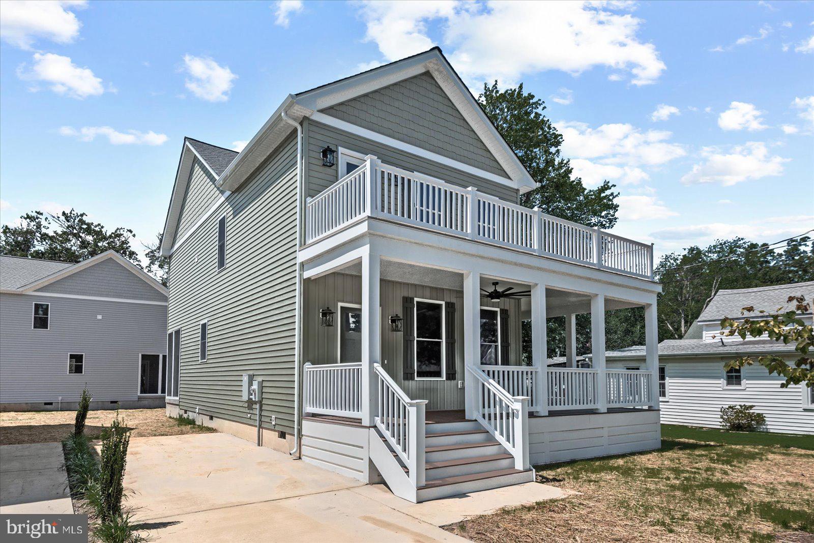 702 Taggart Street Colonial Beach, VA 22443 - Photo 2 of 64 a view of a house with a yard balcony