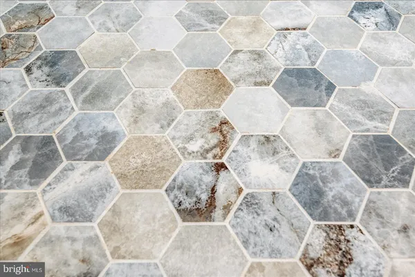a bathroom with a granite countertop sink a toilet and a bathtub