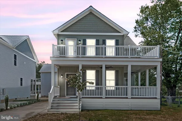 a view of a porch with wooden floor and fence