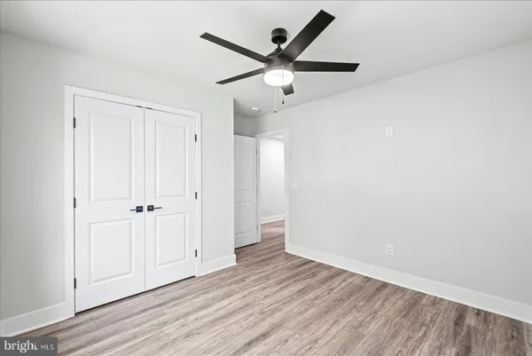 an aerial view of residential houses with outdoor space and parking