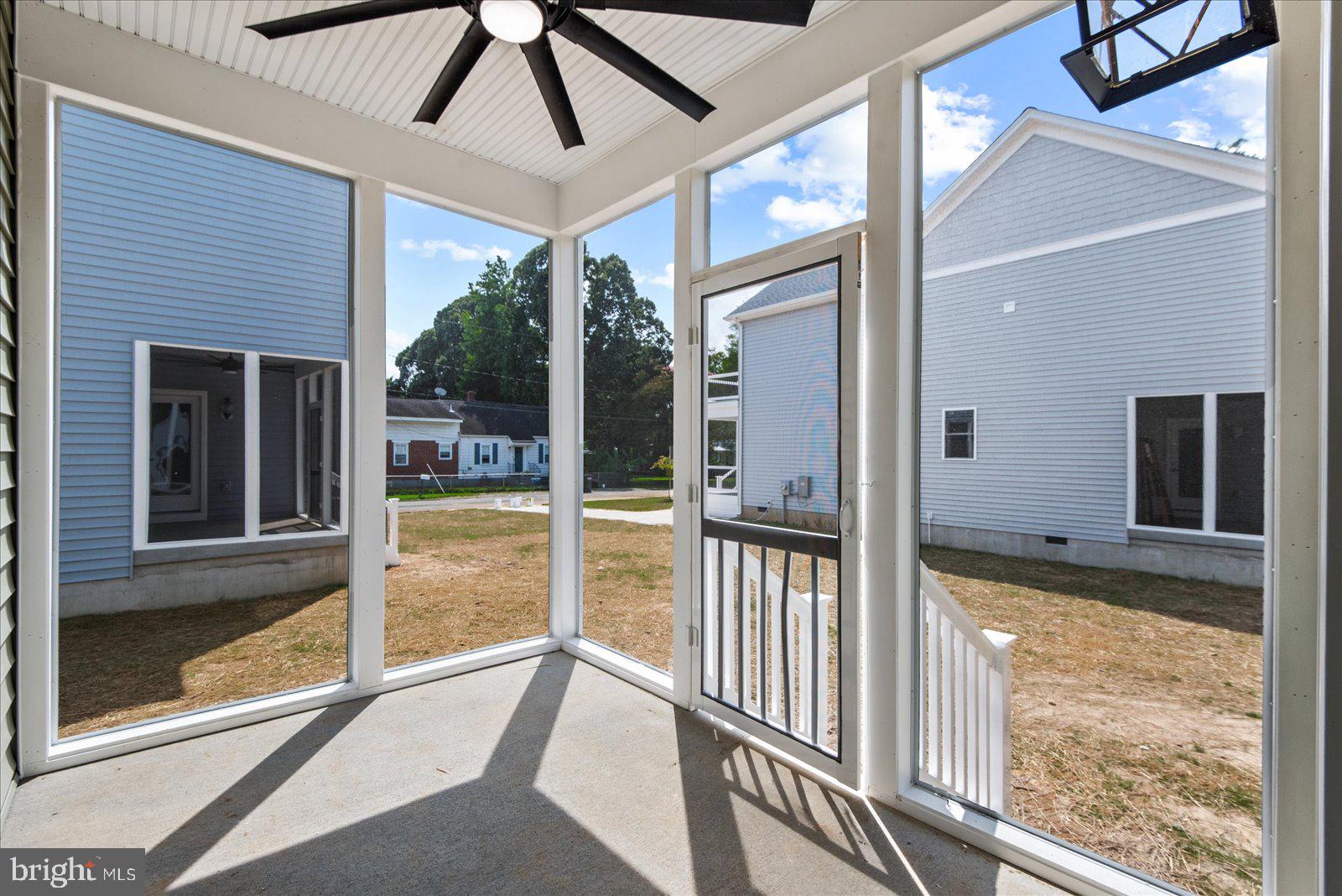 702 Taggart Street Colonial Beach, VA 22443 - Photo 39 of 64 a view of a porch with a floor to ceiling window