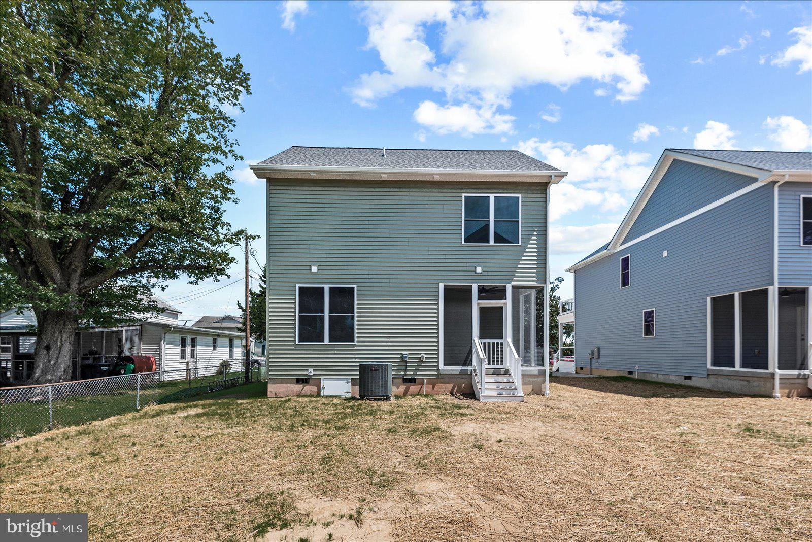 702 Taggart Street Colonial Beach, VA 22443 - Photo 40 of 64 a view of a house with a yard