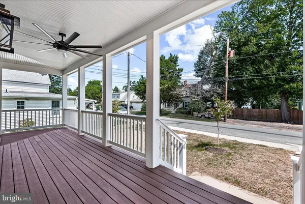 a view of livingroom with hardwood floor and ceiling fan