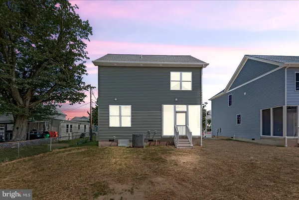 an aerial view of house with swimming pool outdoor seating and yard