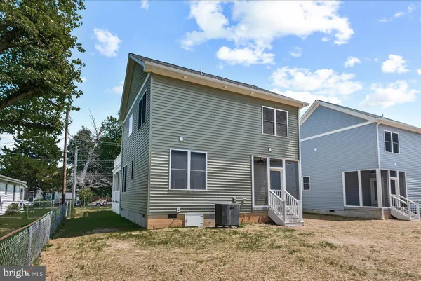an aerial view of residential house with outdoor space and swimming pool