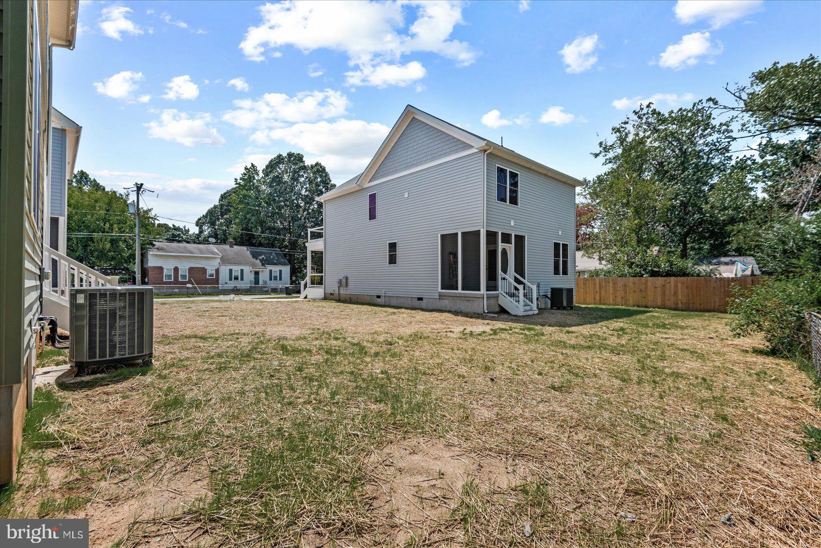 702 Taggart Street Colonial Beach, VA 22443 - Photo 44 of 64 a view of a house with backyard and a tree