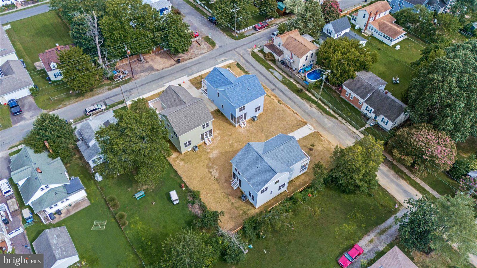 702 Taggart Street Colonial Beach, VA 22443 - Photo 50 of 64 an aerial view of house with swimming pool outdoor seating and yard