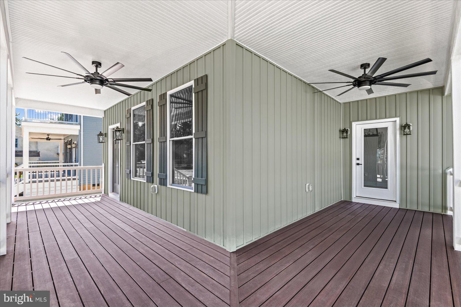 702 Taggart Street Colonial Beach, VA 22443 - Photo 5 of 64 a view of livingroom with hardwood floor and ceiling fan