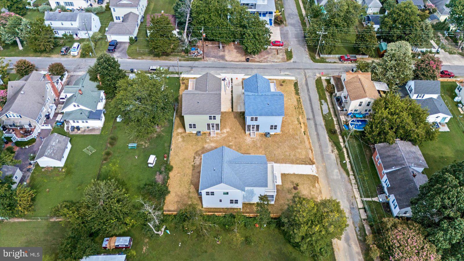 702 Taggart Street Colonial Beach, VA 22443 - Photo 51 of 64 an aerial view of residential houses with outdoor space and trees all around