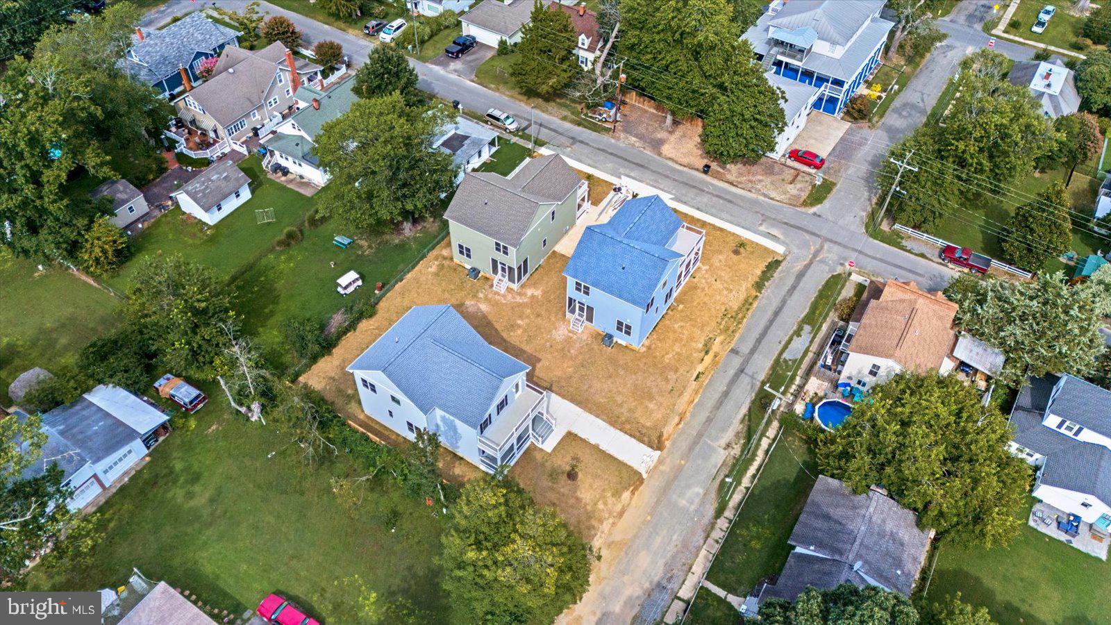 702 Taggart Street Colonial Beach, VA 22443 - Photo 52 of 64 an aerial view of residential house with outdoor space and swimming pool