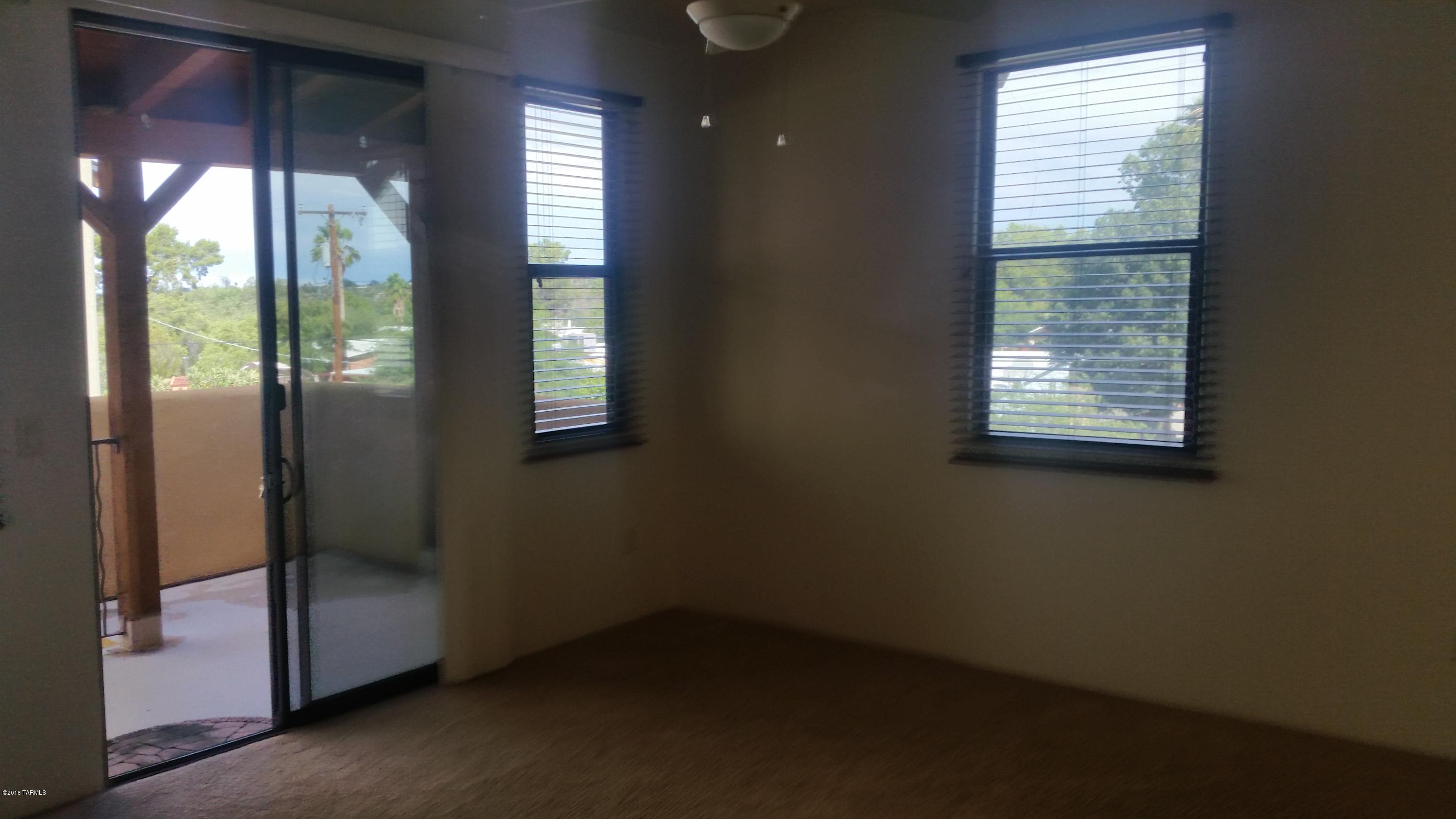 478 East Cedarvale Road Tucson, AZ 85704 - Photo 32 of 39 an empty room with windows