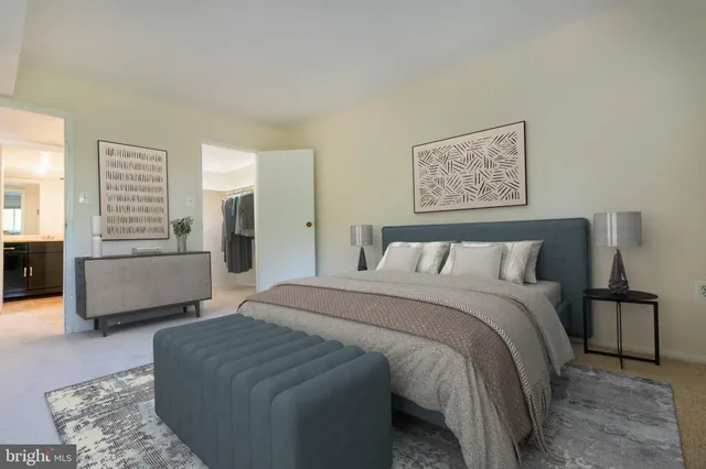 a bedroom with a bed and a couch