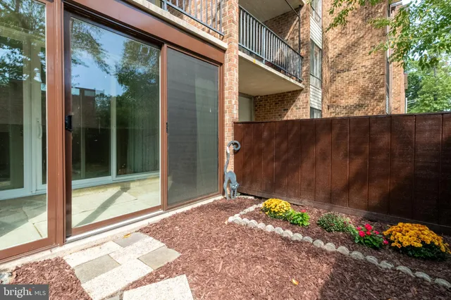 a view of backyard with tub and flowers