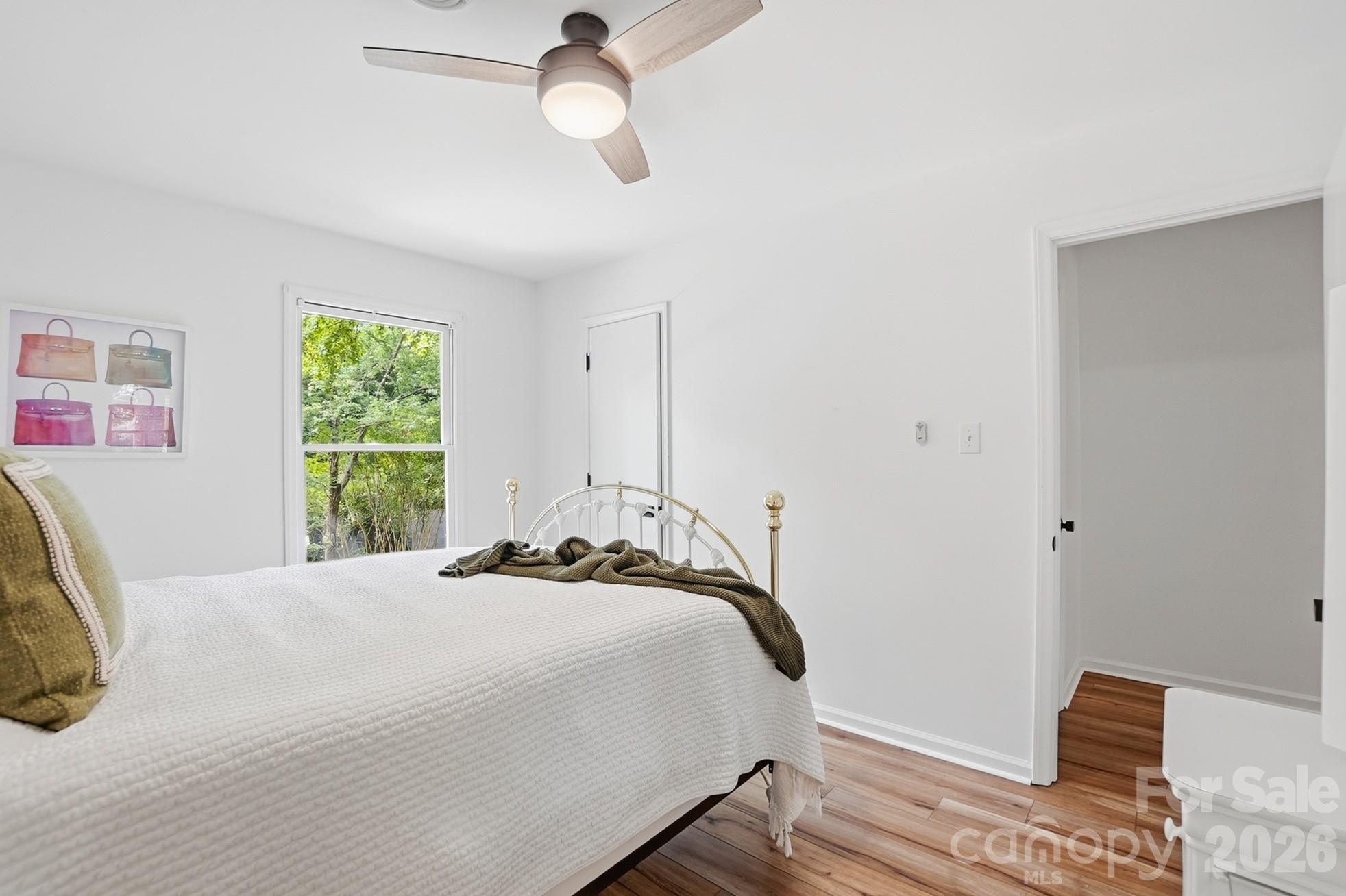 5060 Suwarrow Circle Tega Cay, SC 29708 - Photo 22 of 34 a bedroom with a bed and a window