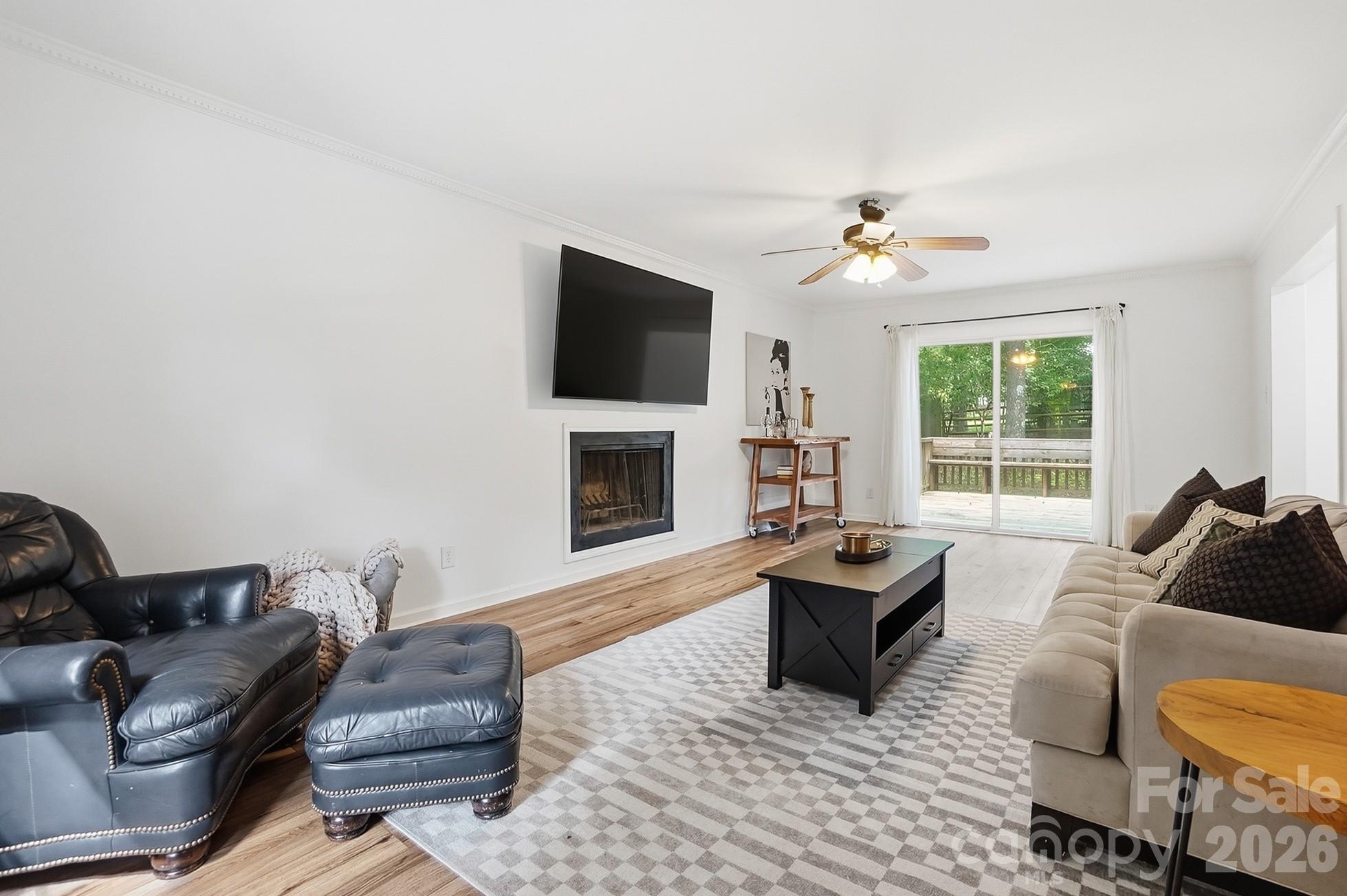 5060 Suwarrow Circle Tega Cay, SC 29708 - Photo 3 of 34 a living room with furniture fireplace and flat screen tv