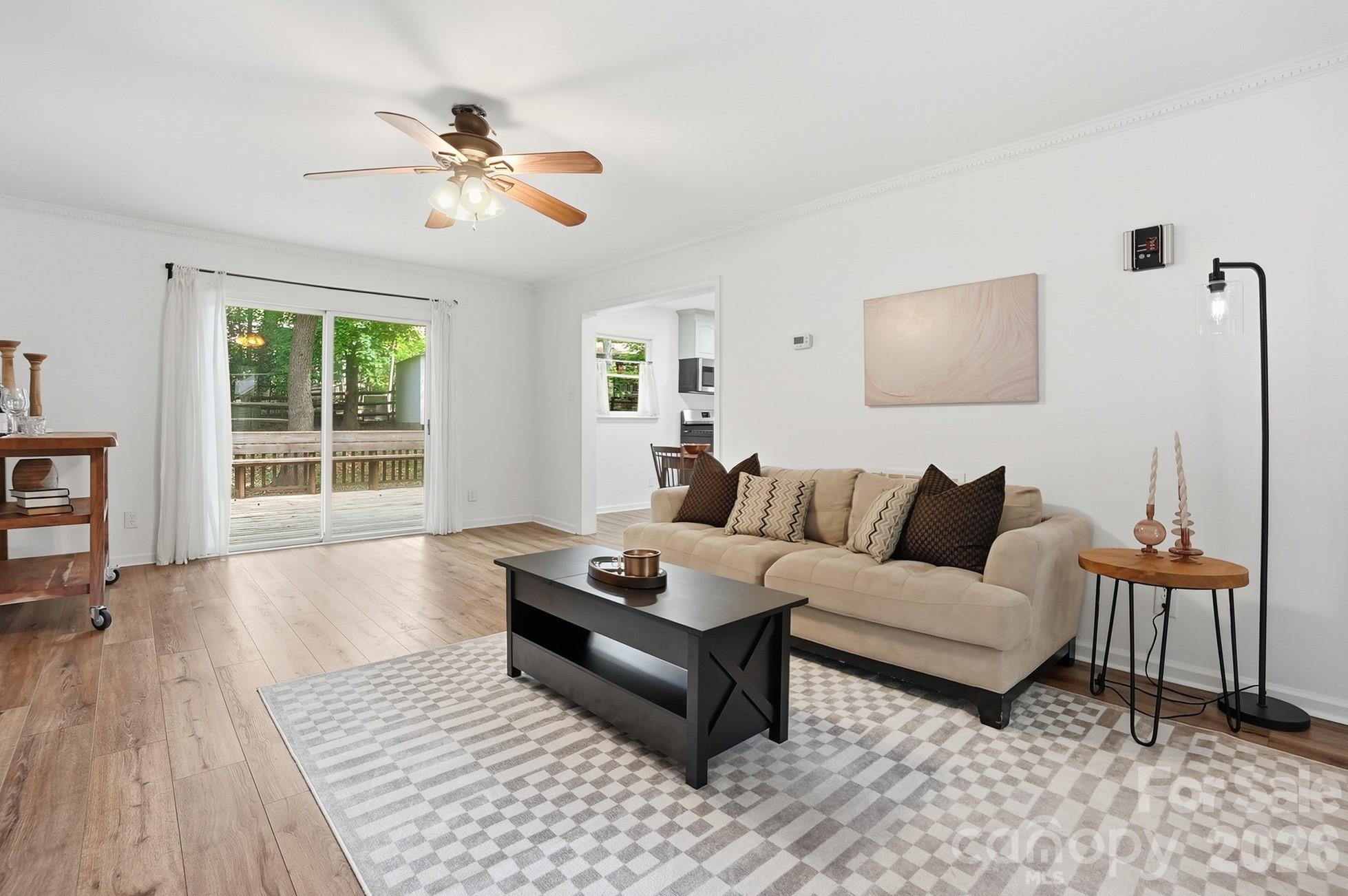 5060 Suwarrow Circle Tega Cay, SC 29708 - Photo 6 of 34 a living room with furniture and a large window