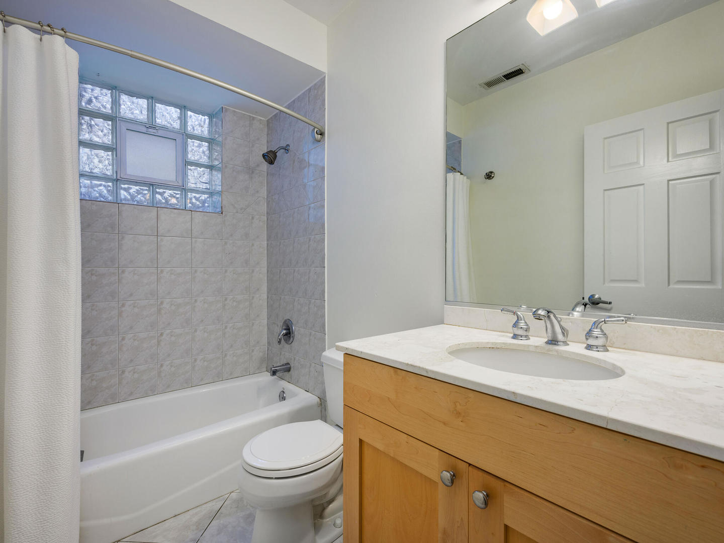 1012 North Wood Street, Unit 2 Chicago, IL 60622 - Photo 15 of 21 a bathroom with a sink a toilet and shower
