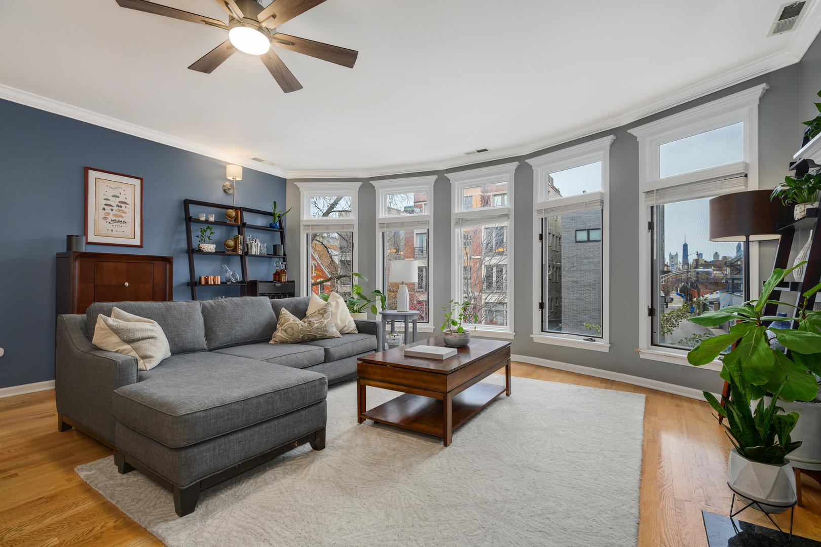 1012 North Wood Street, Unit 2 Chicago, IL 60622 - Photo 4 of 21 a living room with furniture and a large window with wooden floor