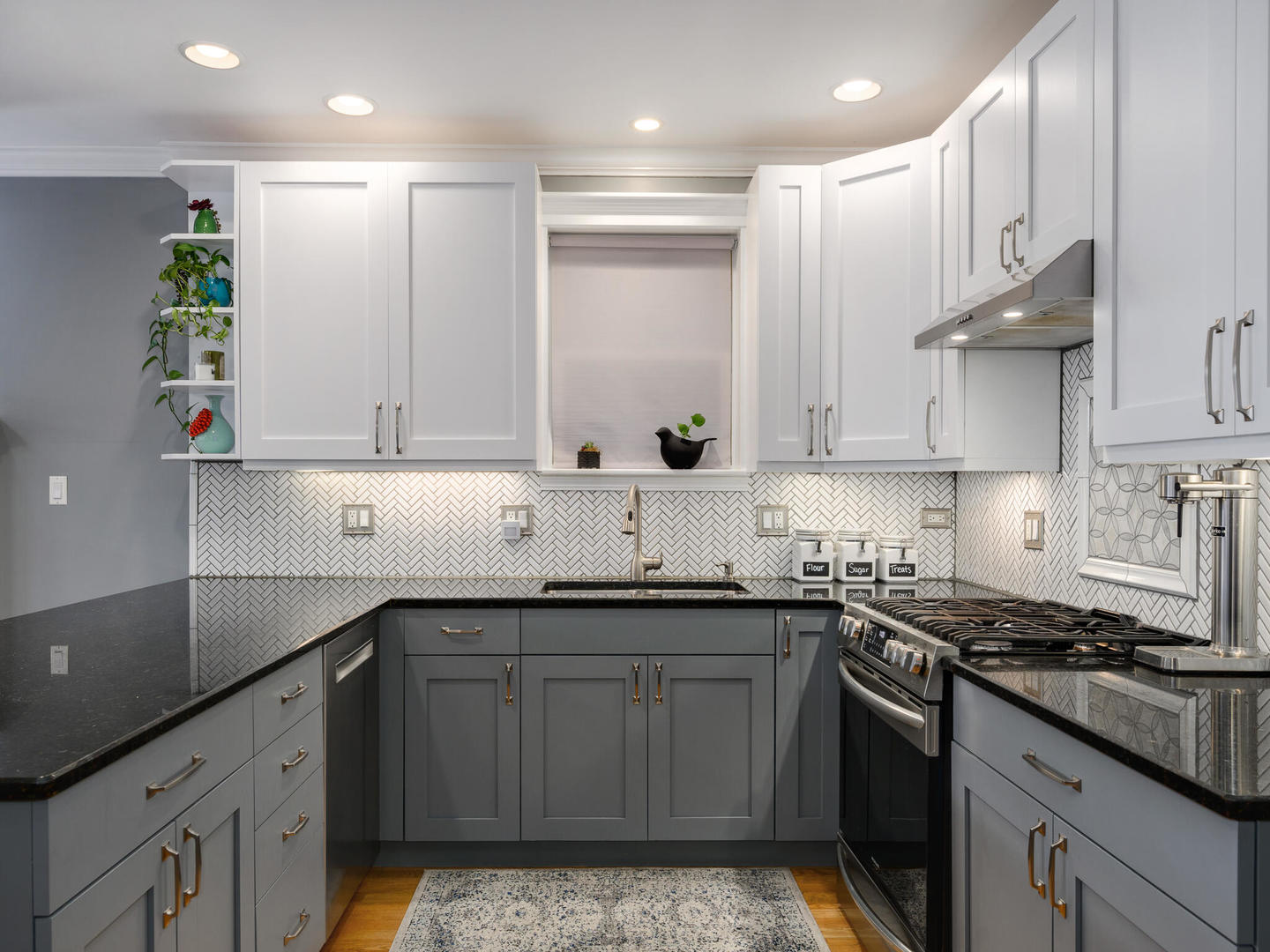 1012 North Wood Street, Unit 2 Chicago, IL 60622 - Photo 8 of 21 a kitchen with kitchen island granite countertop a sink a stove and cabinets